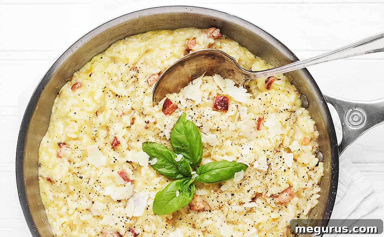 Baked Carbonara Risotto in a rustic skillet, ready to serve.