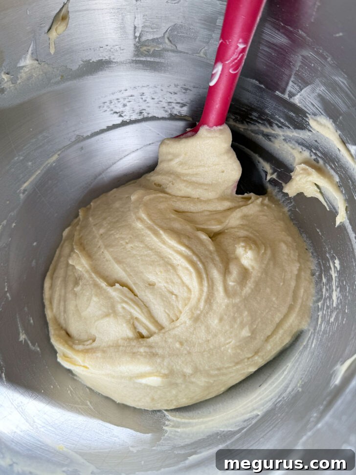 Scarping down the mixing bowl.