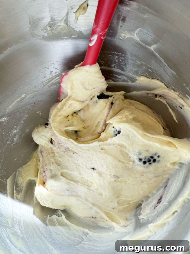 Blackberries folded into the batter.