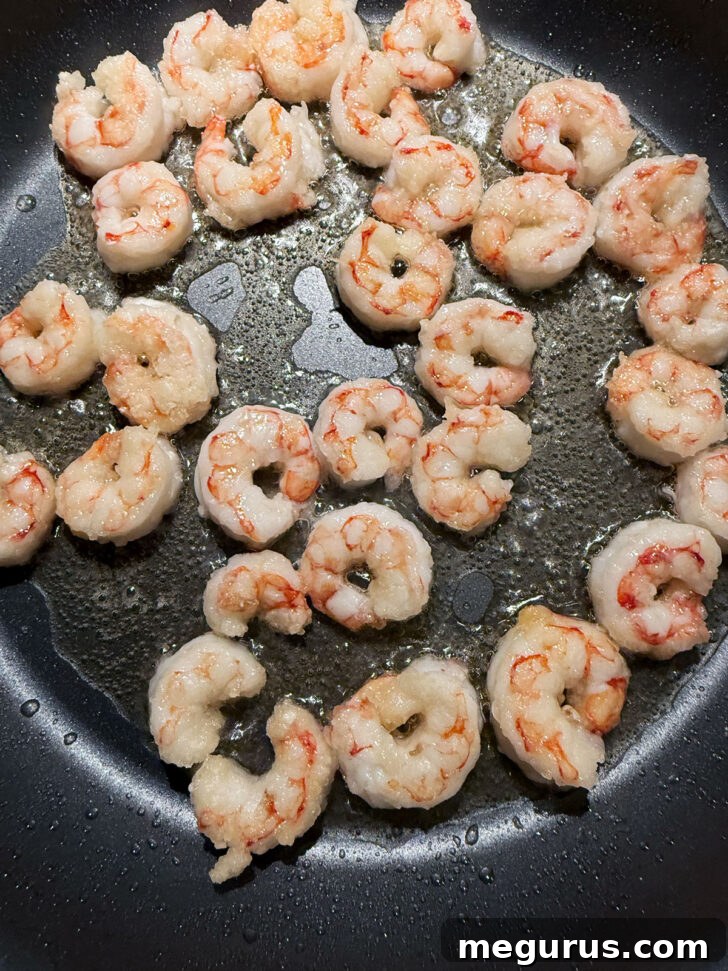 Cooked shrimp in the skillet.