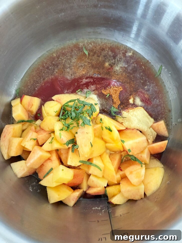 Peach bbq sauce ingredients in a saucepan before cooking.