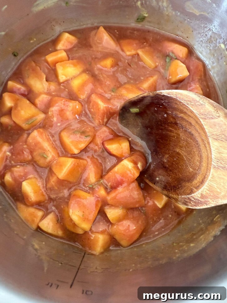 Peach bbq sauce simmering on the stovetop.