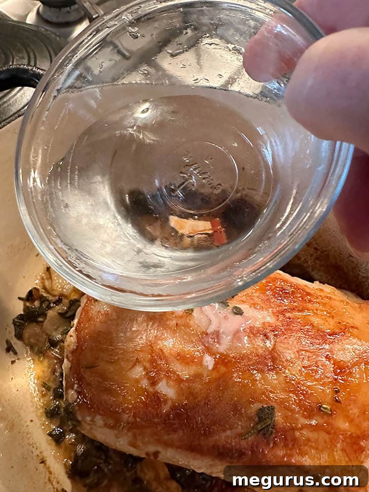 Adding a small amount of water to the pan to prevent drying out during cooking.
