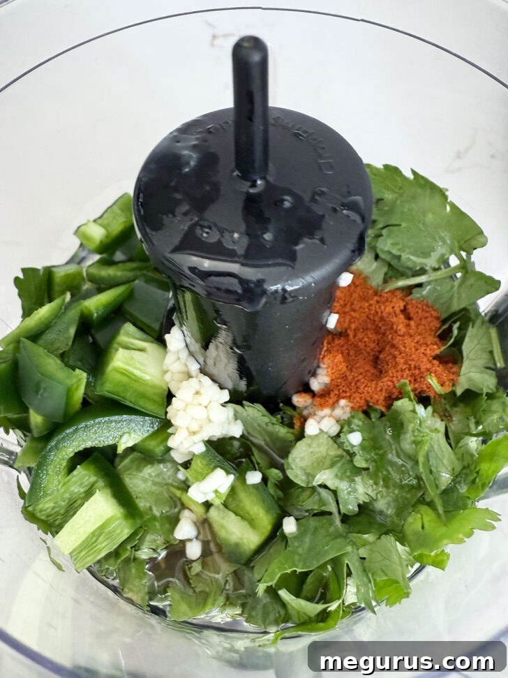 Cilantro lime dressing ingredients in a small food processor.