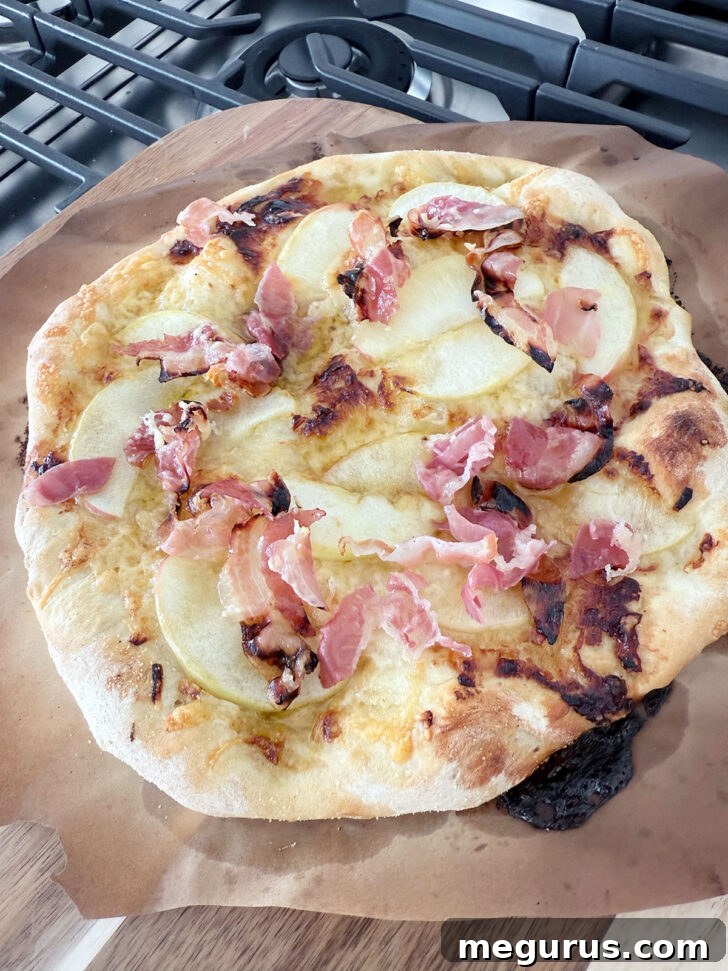 Finished pizza fresh from the oven, glistening and golden.