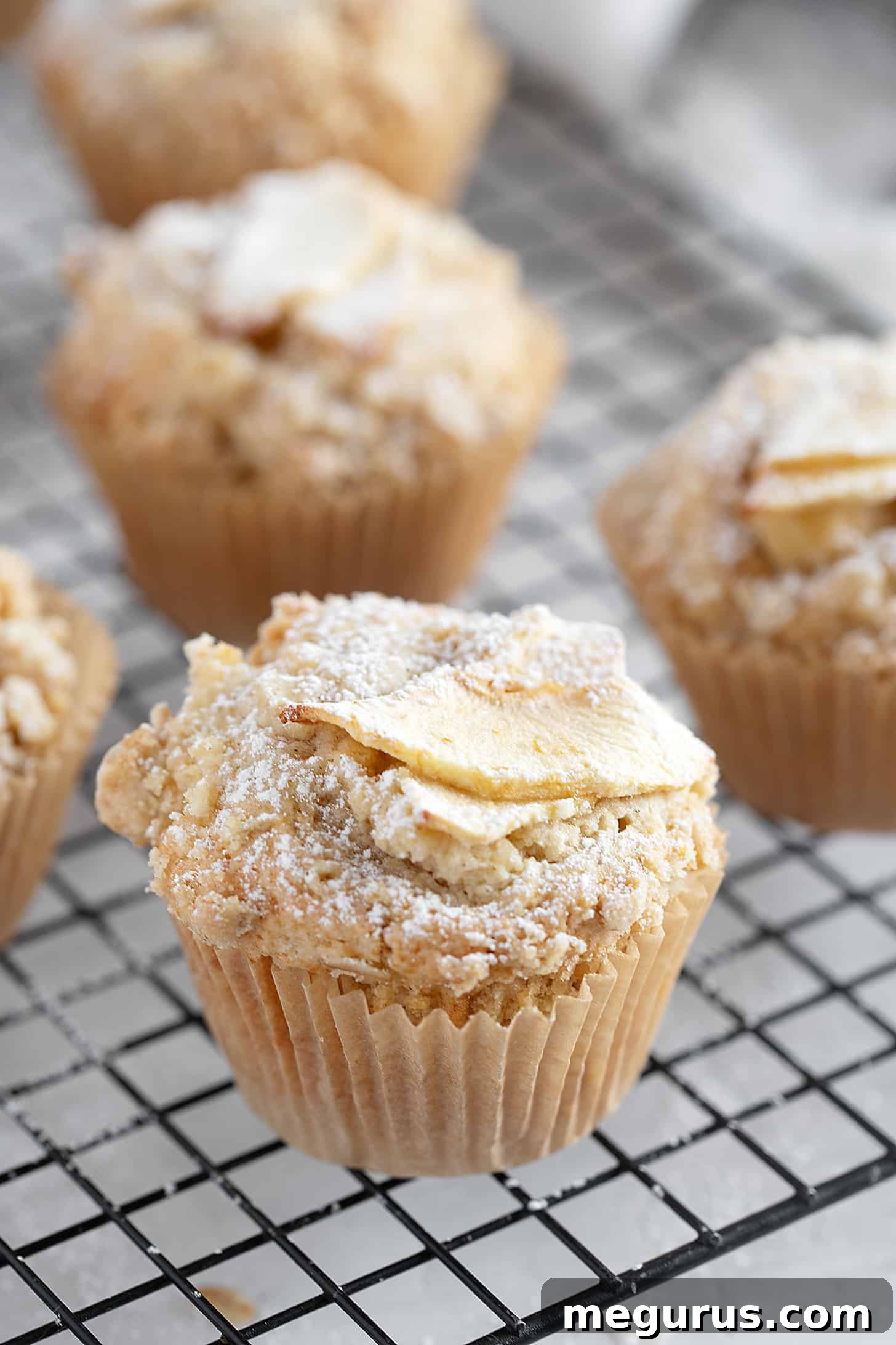 Apple crisp muffins on cooling rack.