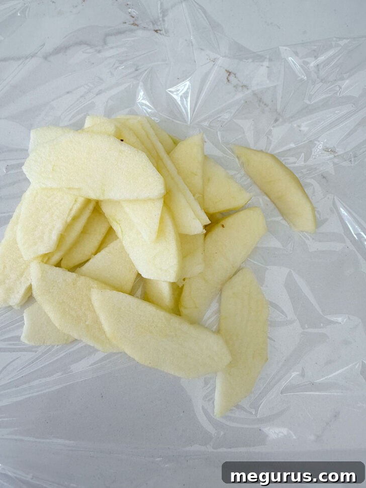 Apple cut into thin slices for topping the muffins.