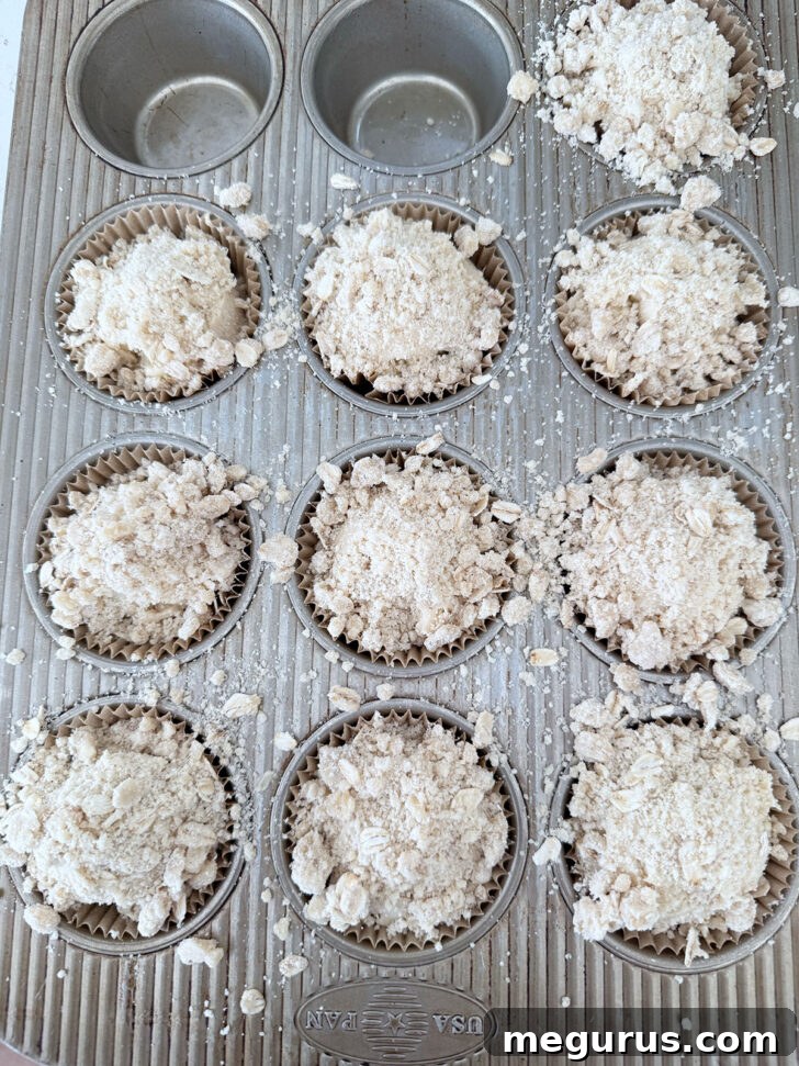 Crisp topping sprinkled over the muffin batter.