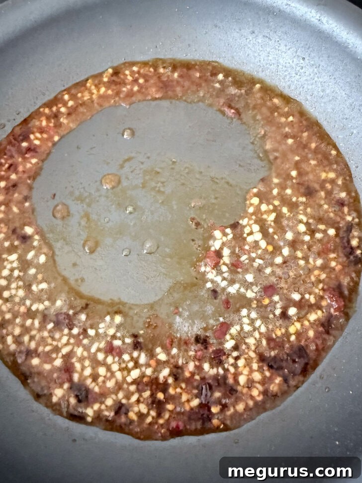 Vodka added to the skillet and cooking off.