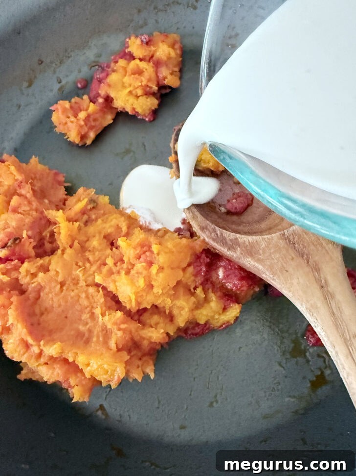 Adding the cream to the skillet.