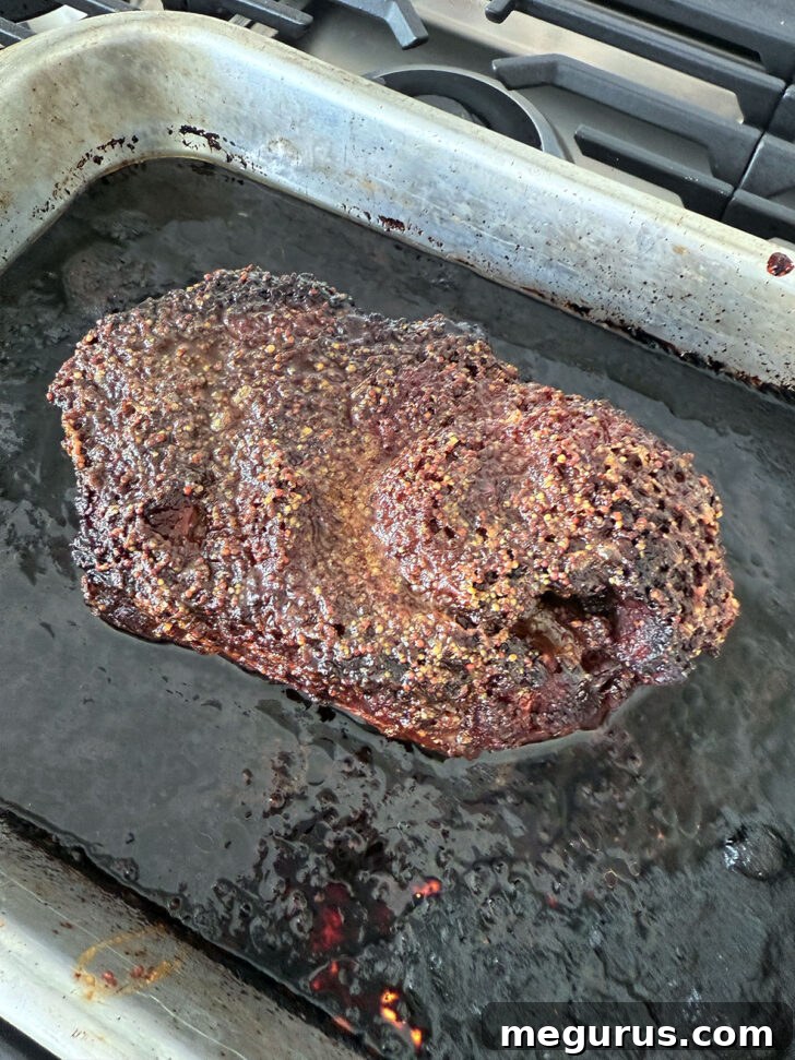 Golden brown maple mustard pork after roasting in the oven, showcasing its delicious caramelized crust.