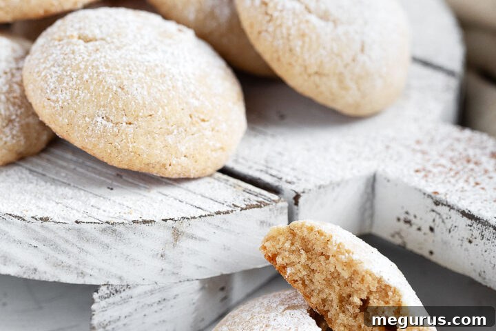 Brown butter cinnamon cookies on a serving board, showcasing their beautiful crackle.