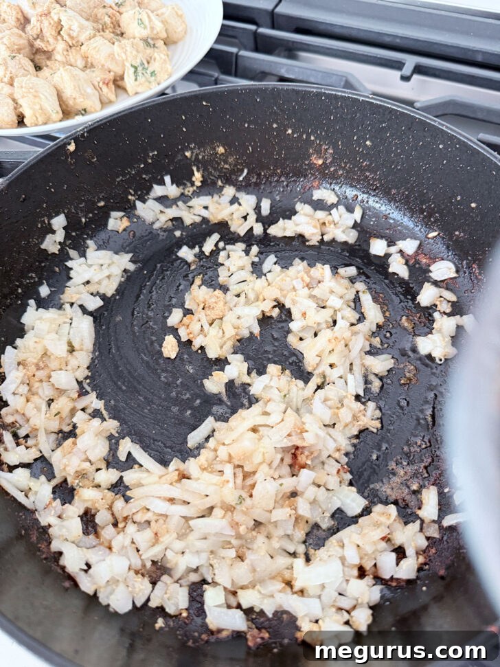 Cooking onion in a skillet.
