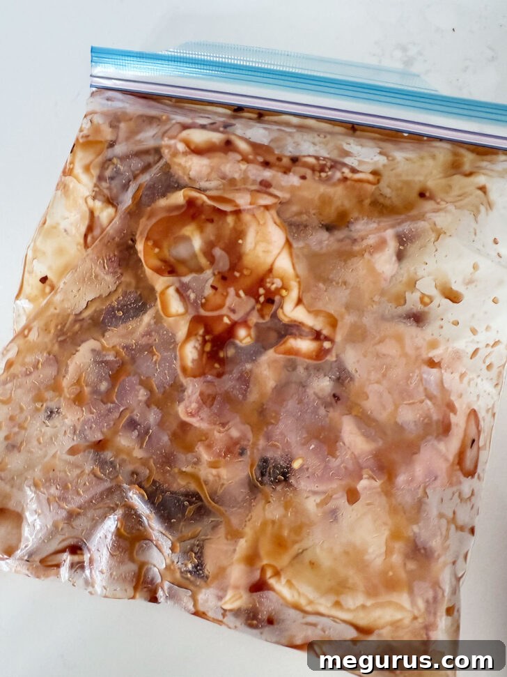 Marinating chicken in a plastic zip bag.