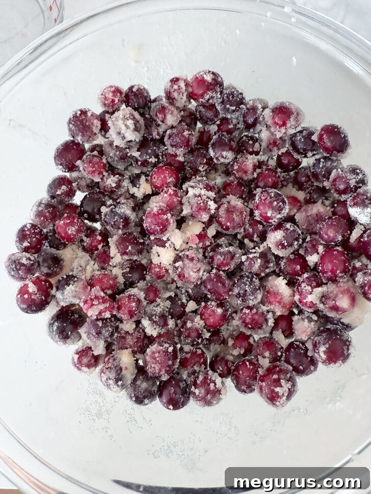 Fresh cranberry filling, mixed with sugar and orange juice, in a bowl.