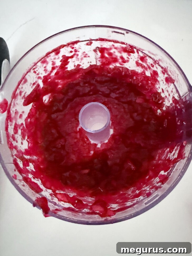 Cranberry apple glaze after processing, showing its smooth consistency.