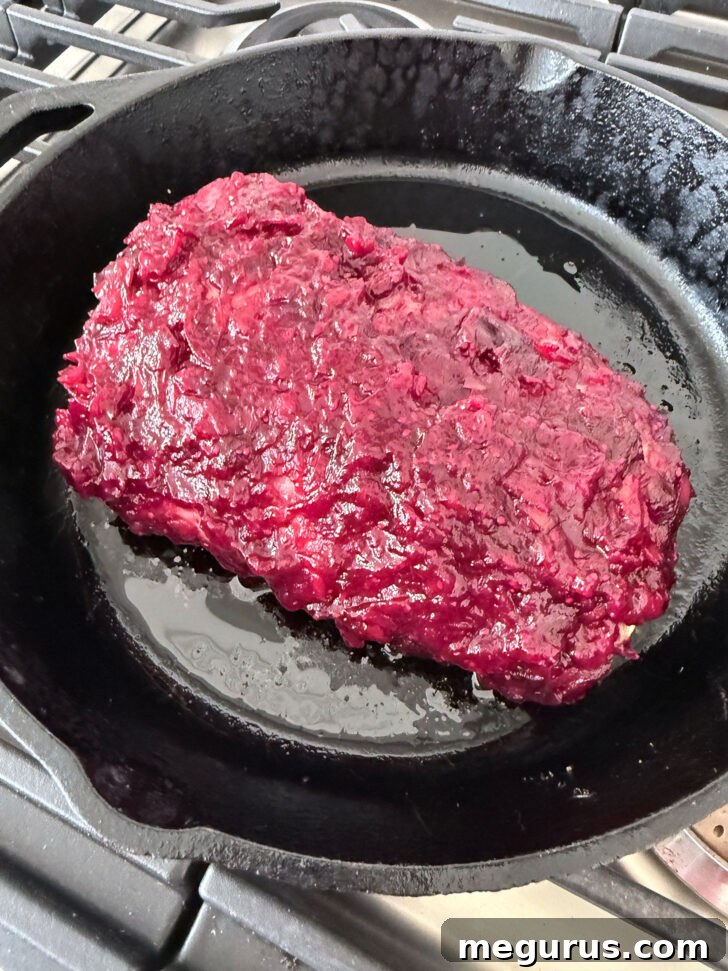 Pork roast after cooking, beautifully glazed with the cranberry apple sauce.