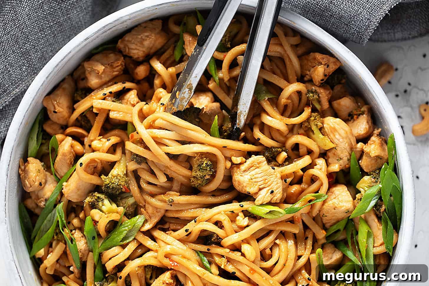 Chicken cashew noodles in a skillet, ready to serve.