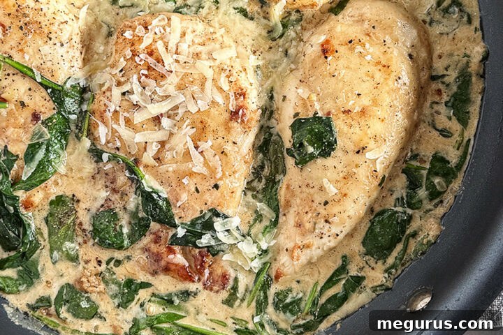 Chicken Florentine in a skillet.