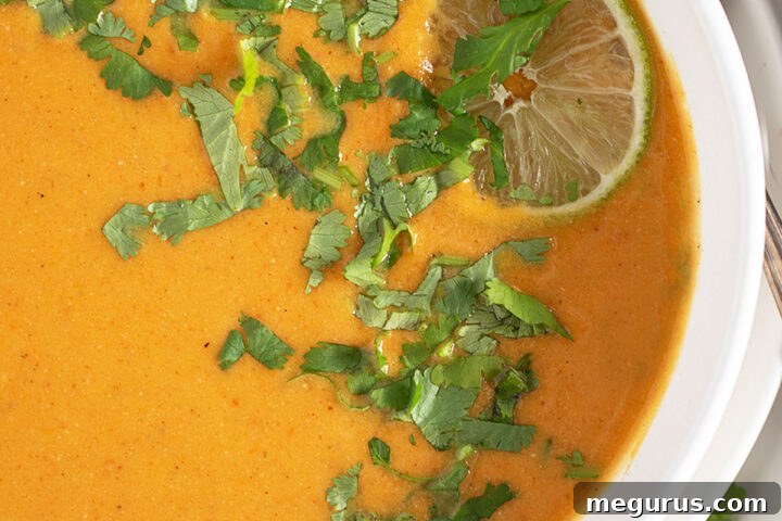Sweet potato coconut soup in a bowl, ready to be served.