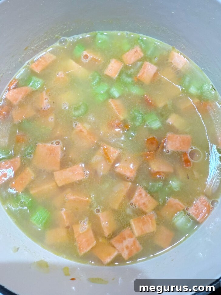 Sweet potato added to the soup pot.