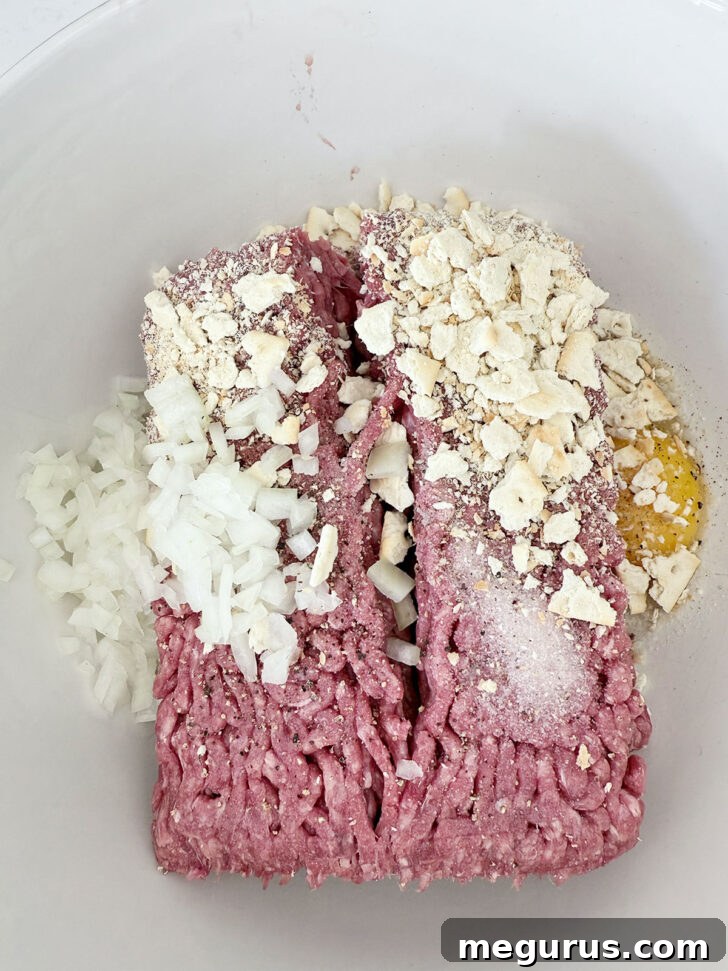 Meatloaf mixture in a mixing bowl, ready for shaping.