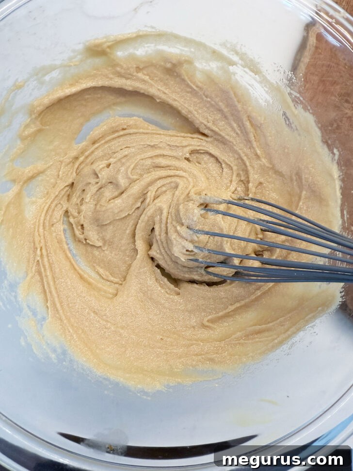 Smooth, well-combined batter after whisking in the egg mixture.