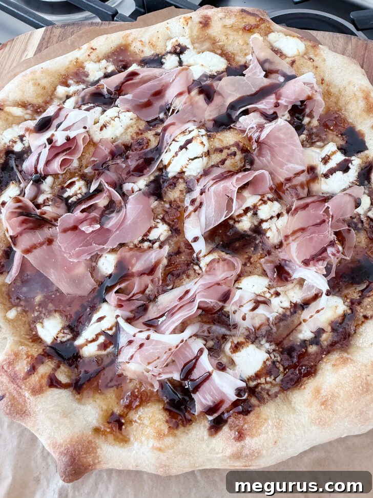 Balsamic glaze drizzled over the pizza, adding a finishing touch.