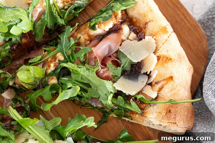 Fig and pig pizza sliced on a pizza peel. A vibrant, gourmet pizza ready to be served.