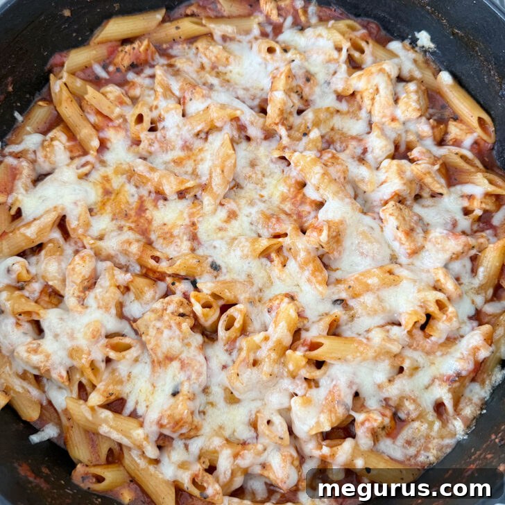 Pasta after broiling, with melted and slightly browned cheese.