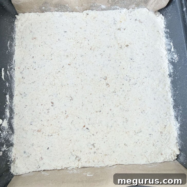 Base pressed into a baking pan.