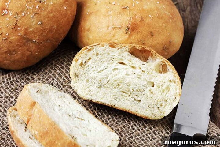 mini rosemary olive oil bread sliced with knife