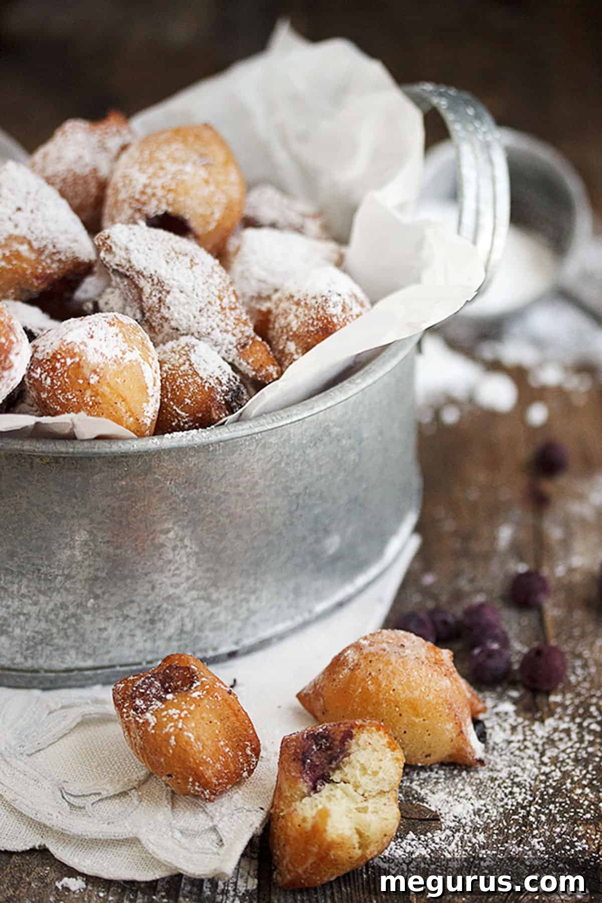 mini blueberry beignets in bucket
