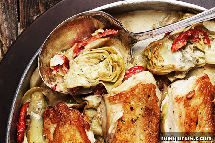 sun dried tomato artichoke chicken in serving dish
