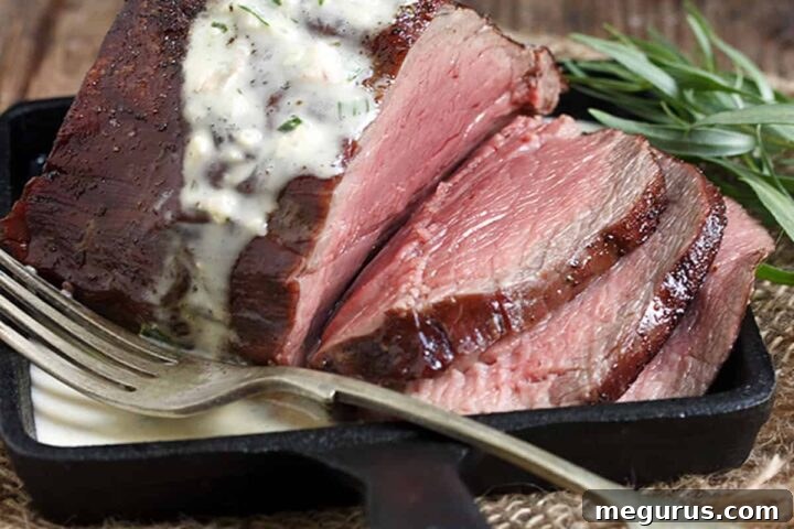 reverse seared chateaubriand on skillet with bernaise sauce