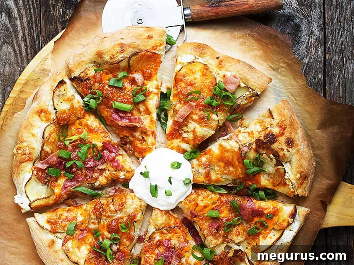 Spicy Perogy Pizza with creamy garlic sauce, potatoes, jalapenos, and melted cheese