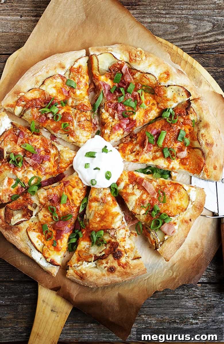 spicy perogy pizza sliced on pizza peel, showing crispy crust and generous toppings