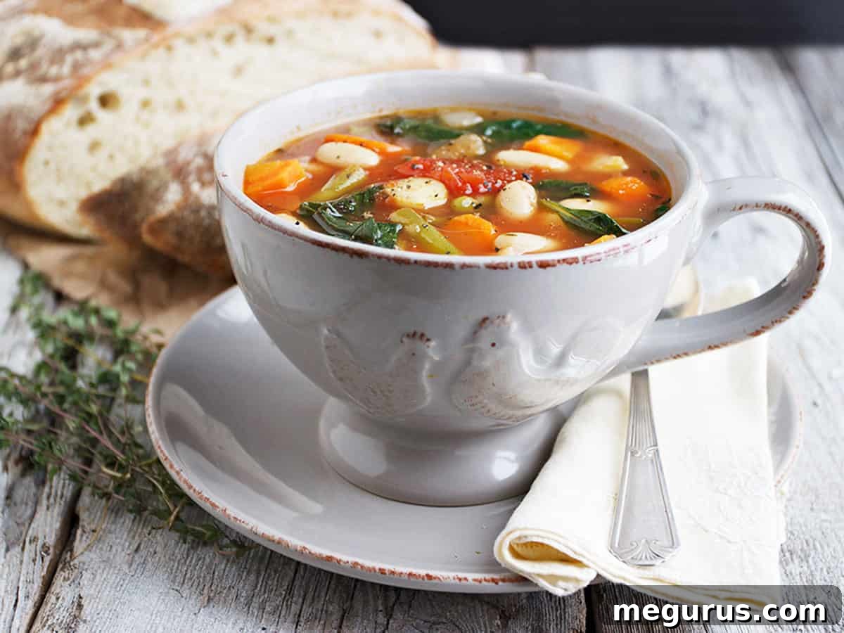 Provencal vegetable soup served in a rustic bowl with crusty bread