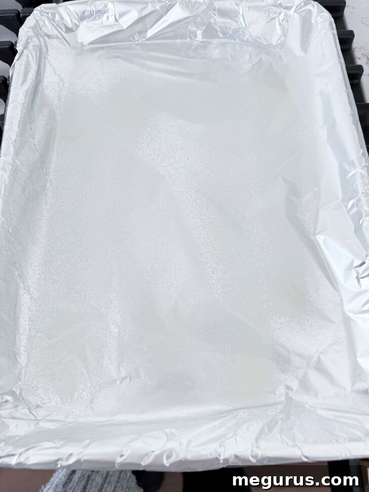 Baking sheet lined with aluminum foil and lightly sprayed with cooking spray or brushed with oil.