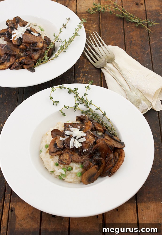 A close-up shot of baked Parmesan risotto with a generous serving of Marsala mushrooms on top, garnished with fresh herbs.