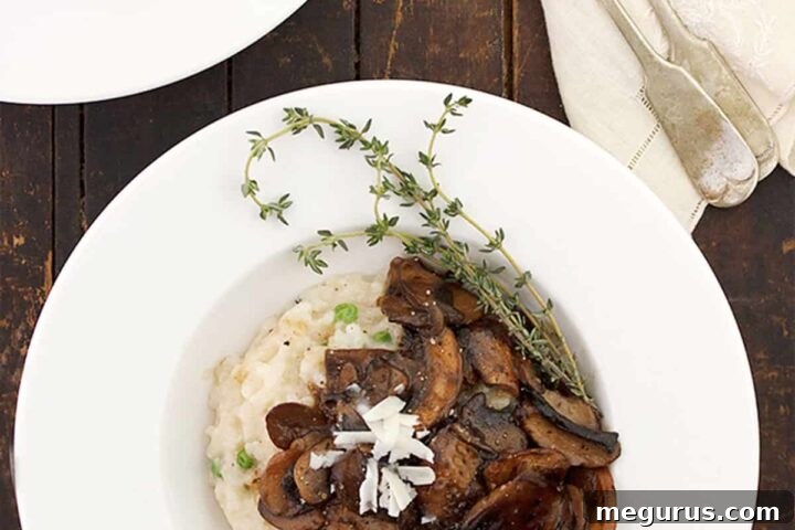 A prepared dish of Mushroom Marsala Risotto in a shallow bowl, showcasing its rich texture and mushroom topping.