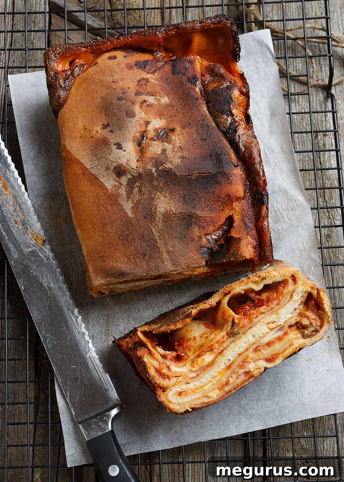 Close-up of baked Italian Scaccia Ragusana with crispy edges and a rustic appearance