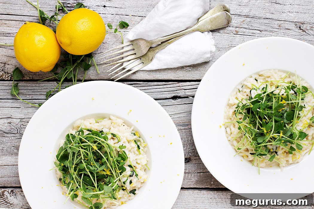 Bright Lemon Risotto garnished with fresh pea shoots, served in a white bowl