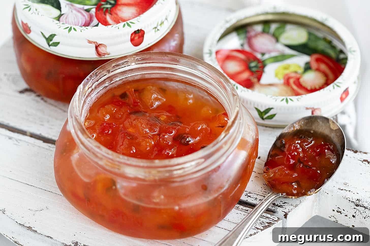 Homemade Peach and Pepper Jam beautifully presented in sealed glass jars.