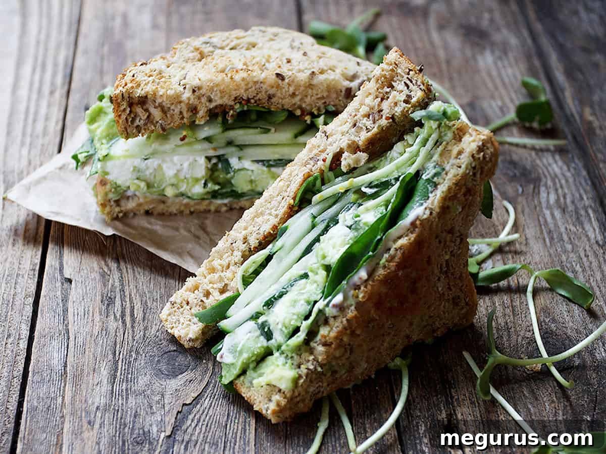 Green Goddess Sandwich on a rustic wooden background, showcasing fresh ingredients