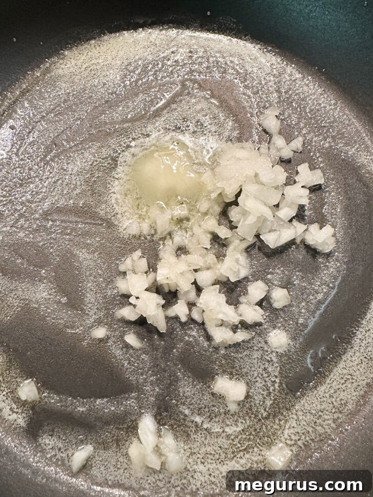 Onion added to melted butter in skillet.