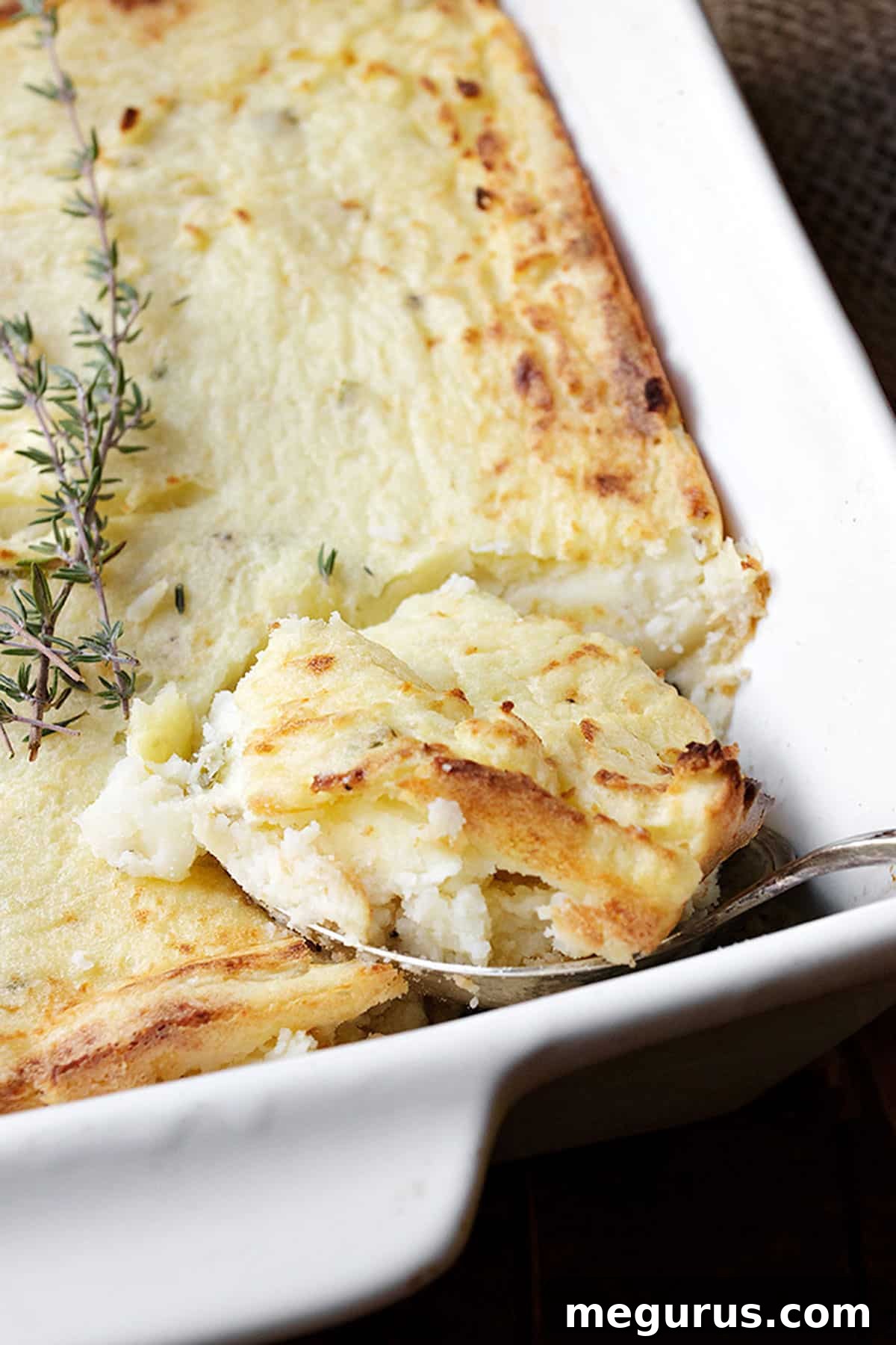 make ahead mashed potato casserole in white dish with spoon