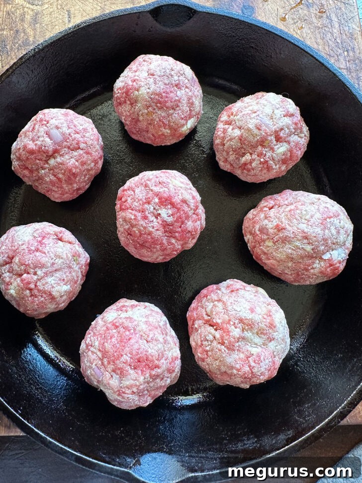 meatballs formed and in skillet before baking