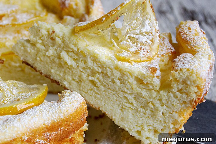 lemon ricotta cake sliced on cake plate