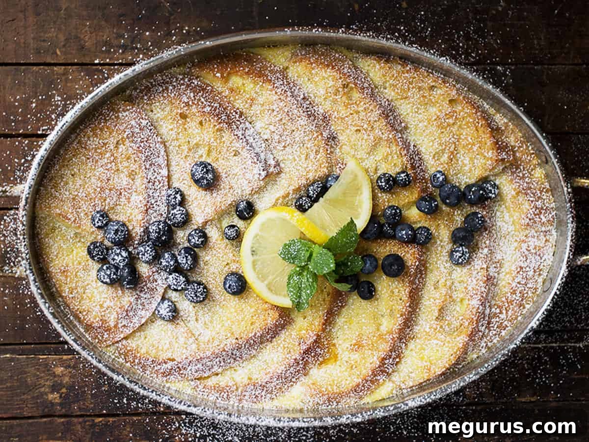 lemon French toast in baking dish with blueberries and lemon slices